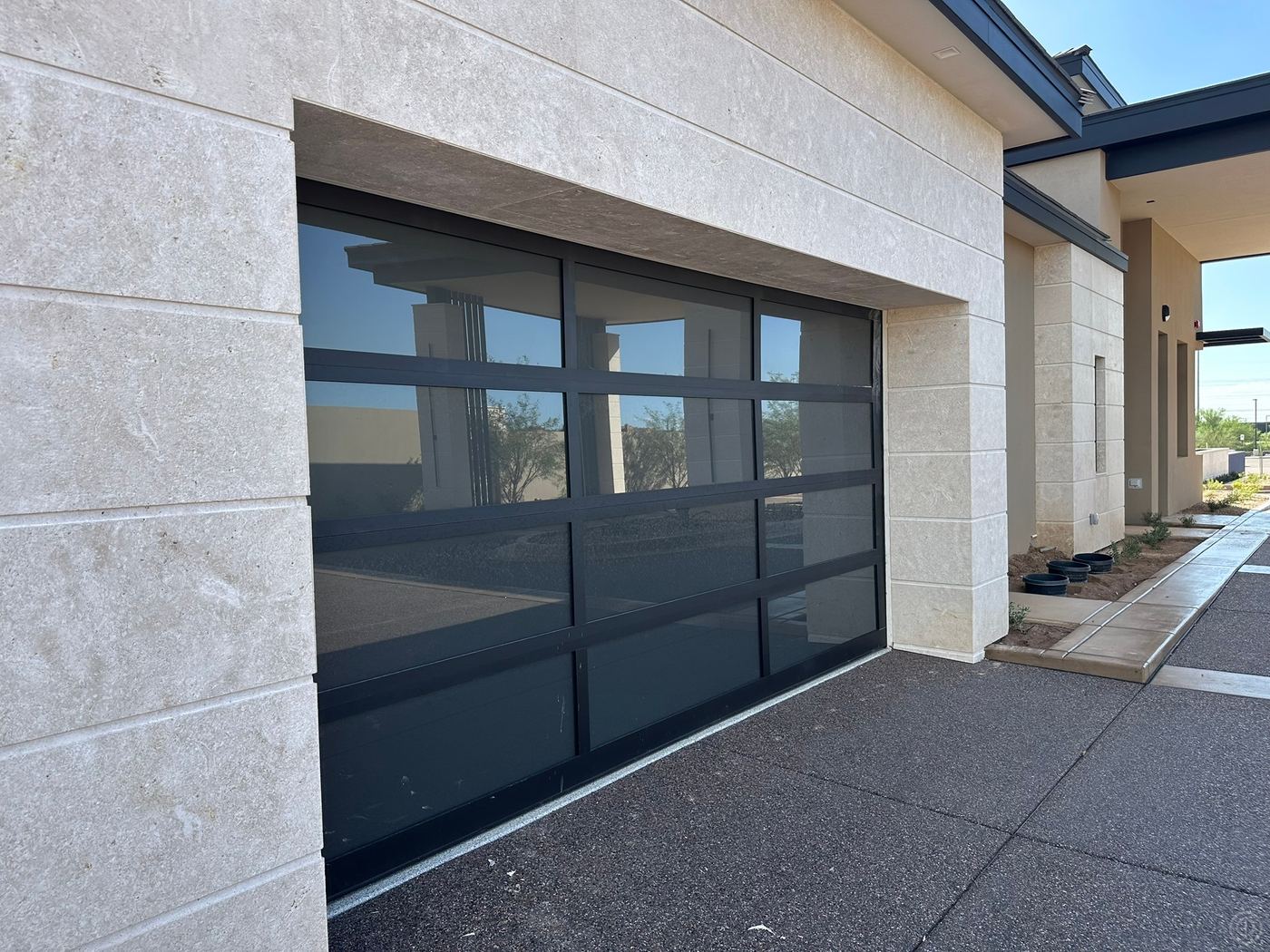 Garage & entry · limestone cladding — Private residence
