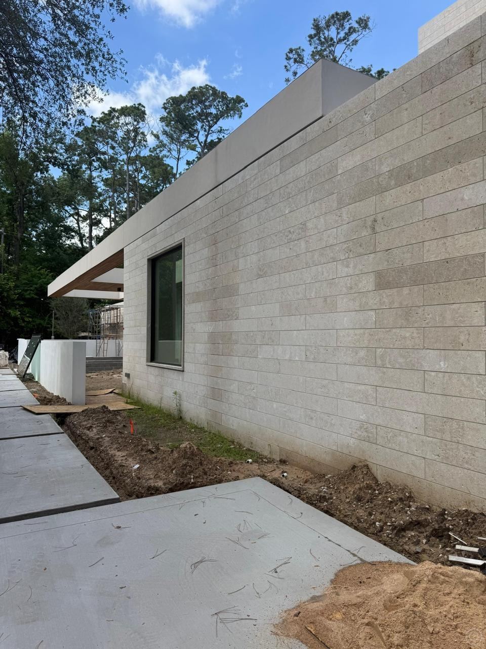 Facade · large-format limestone — Private residence
