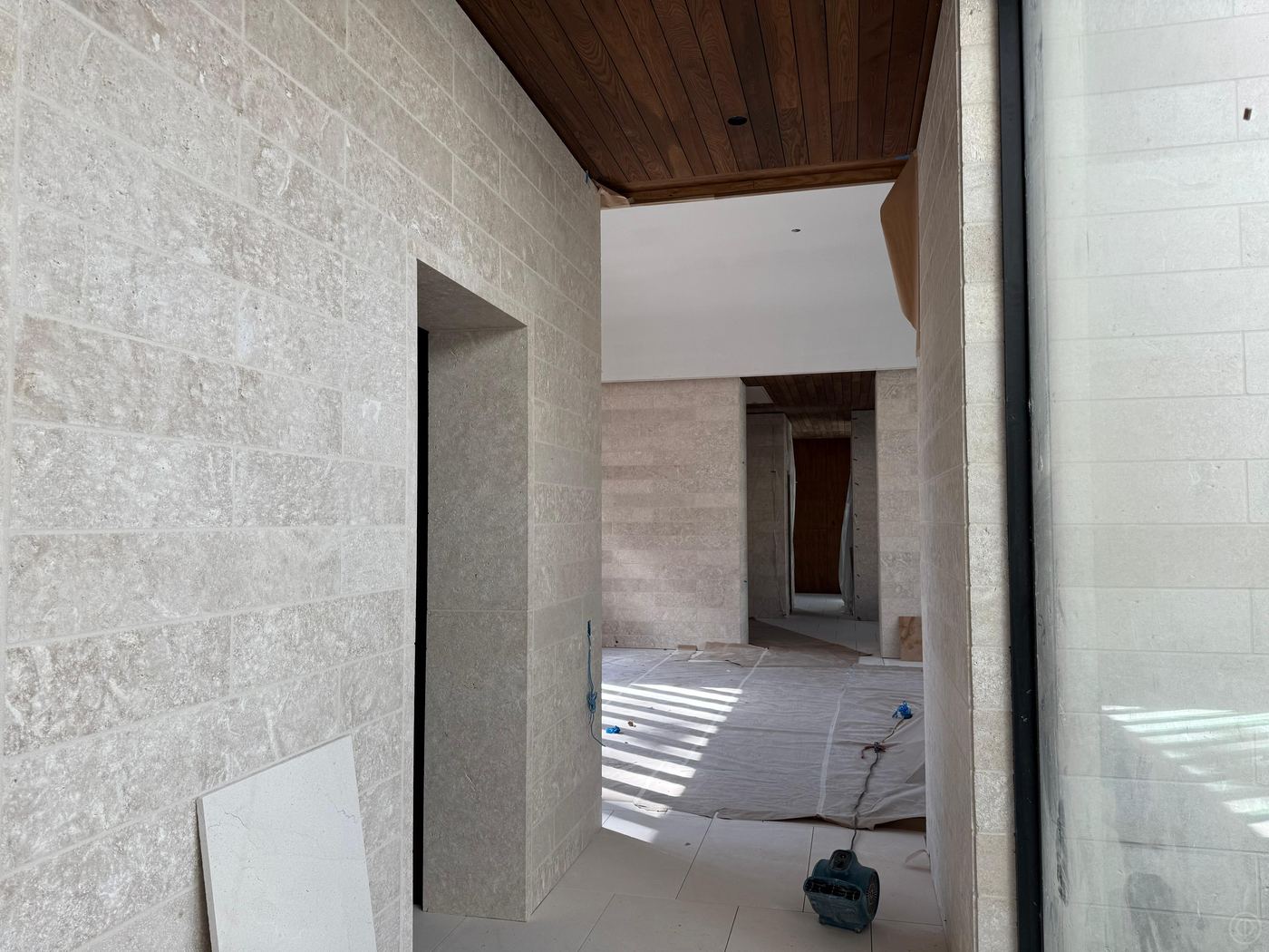 Interior passage · limestone walls — Private residence