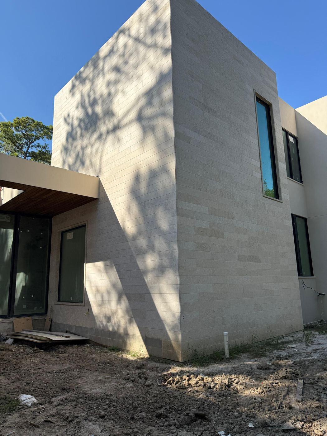 Corner detail · limestone cladding — Private residence
